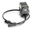 The Husqvarna Battery Adaptor features a digital display and a long, coiled power cable—ideal for use with a backpack battery. Shown here in black against a plain background.