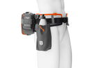 A mannequin wears the Husqvarna Battery Belt Flexi (3 variants), featuring an ergonomic design, a Husqvarna battery pack, and a black side pouch for a water bottle.