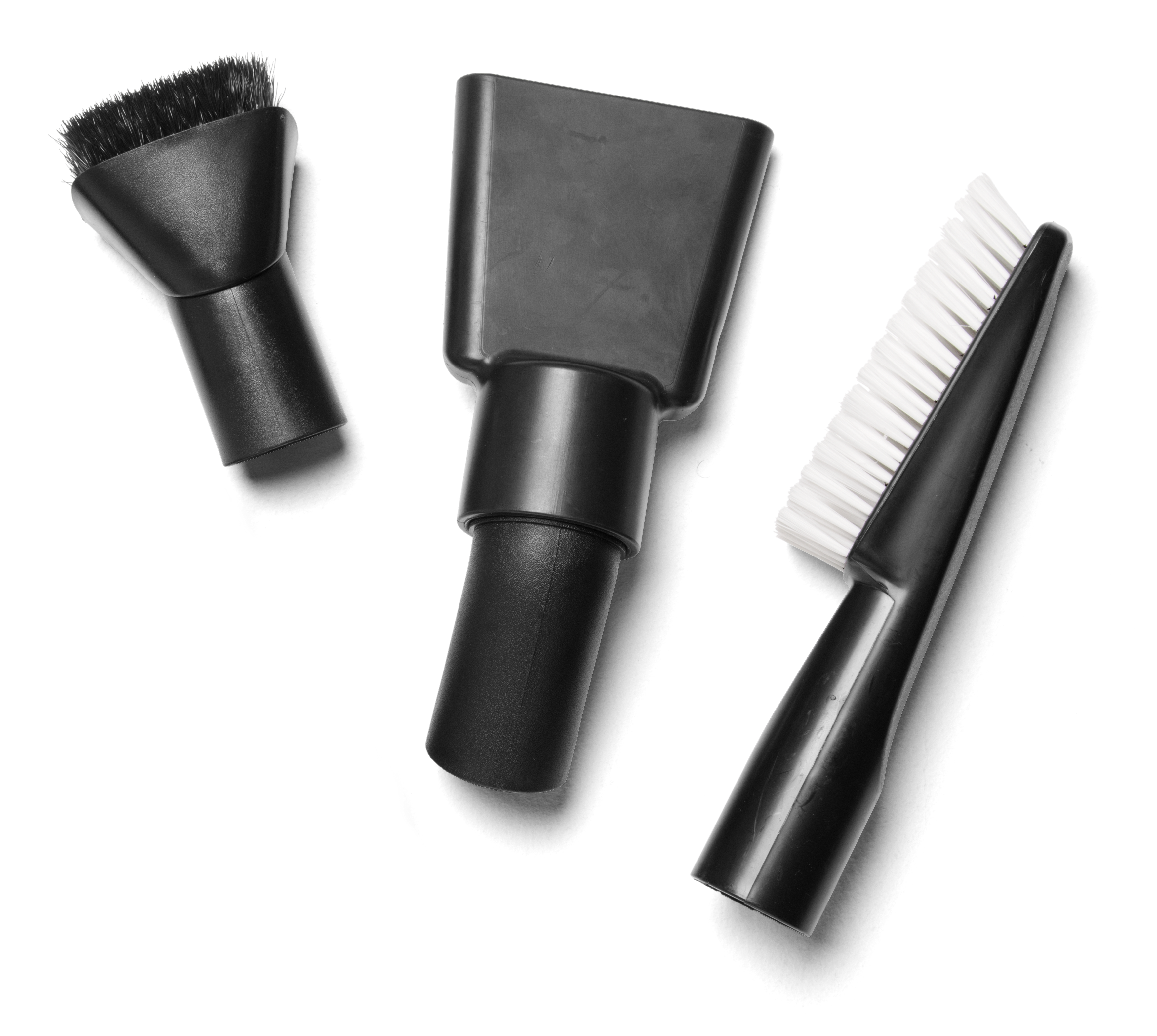 The Husqvarna Cleaning Nozzle Kit features three black attachments—a round brush, a flat nozzle, and a narrow brush with white bristles—perfect for cleaning vehicles and displayed on a white background.