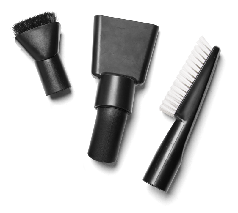 The Husqvarna Cleaning Nozzle Kit features three black attachments—a round brush, a flat nozzle, and a narrow brush with white bristles—perfect for cleaning vehicles and displayed on a white background.