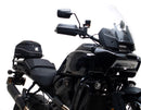 The image of the EVO-12 Bike-Pack Kit displays three components: a Ventura bike-pack with logo, an EVO-rack seamlessly attached to a Harley Davidson Pan America 1250 frame, and an L-bracket with screws and rods.