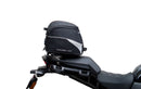 The image of the EVO-12 Bike-Pack Kit displays three components: a Ventura bike-pack with logo, an EVO-rack seamlessly attached to a Harley Davidson Pan America 1250 frame, and an L-bracket with screws and rods.