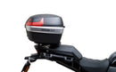 The image of the EVO-12 Bike-Pack Kit displays three components: a Ventura bike-pack with logo, an EVO-rack seamlessly attached to a Harley Davidson Pan America 1250 frame, and an L-bracket with screws and rods.