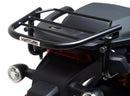 The image of the EVO-12 Bike-Pack Kit displays three components: a Ventura bike-pack with logo, an EVO-rack seamlessly attached to a Harley Davidson Pan America 1250 frame, and an L-bracket with screws and rods.