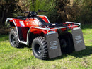 A Honda TRX 420 Rancher FM1, FM2, FA2 (14 - >) ATV by Ventura, red with black accents, large off-road tires, and a sturdy silver bull bar, is parked on pavement with greenery in the background.