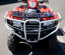 A Honda TRX 420 Rancher FM1, FM2, FA2 (14 - >) ATV by Ventura, red with black accents, large off-road tires, and a sturdy silver bull bar, is parked on pavement with greenery in the background.