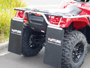 The Ventura Honda TRX 700 FA ATV, featuring bull-bars, a tow-ball, large rugged tires, and a protective metal frame in red and black, is parked on a paved road with trees and a building visible in the background.