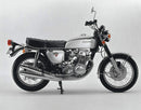Image of the Ventura EVO-12 Bike-Pack Kit for Honda CB 750 K2-K7. Features a black pack with an orange stripe, an adjustable Evo-Rack on a motorcycle, and an L-Bracket with bolts and screws, labeled as a generic image.
