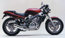 The Ventura EVO-12 Bike-Pack Kit includes a sleek black EVO-12 pack with a logo, an Adjustable Pack-Rack for bike mounting, and a labeled L-Bracket with screws for the Honda NTV 650 Bros (87 >), all showcased in a generic image.