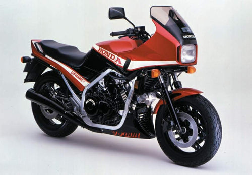 The image showcases a Venture EVO-12 Bike-Pack Kit with an Adjustable Pack-Rack and black pack, highlighted by an orange stripe, on a Honda VF 1000 FE, FD. The EVO-Rack is mounted on the motorcycle. The L-Bracket comes with screws and each piece labeled in striking red text.
