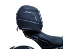 The EVO-12 Bike-Pack Kit offers a stylish Ventura EVO-12 pack with an orange stripe, an adjustable EVO-Rack on the frame, and a detailed L-Bracket with screws. Ideal for Indian FTR models (19 ->), it combines style and functionality for your rides.