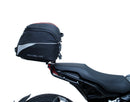 The EVO-12 Bike-Pack Kit offers a stylish Ventura EVO-12 pack with an orange stripe, an adjustable EVO-Rack on the frame, and a detailed L-Bracket with screws. Ideal for Indian FTR models (19 ->), it combines style and functionality for your rides.