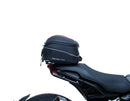 The EVO-12 Bike-Pack Kit offers a stylish Ventura EVO-12 pack with an orange stripe, an adjustable EVO-Rack on the frame, and a detailed L-Bracket with screws. Ideal for Indian FTR models (19 ->), it combines style and functionality for your rides.