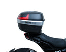 The EVO-12 Bike-Pack Kit offers a stylish Ventura EVO-12 pack with an orange stripe, an adjustable EVO-Rack on the frame, and a detailed L-Bracket with screws. Ideal for Indian FTR models (19 ->), it combines style and functionality for your rides.
