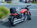 Image featuring a Ventura EVO-12 bike-pack kit for Indian Scout Bobber models, including an EVO-12 pack, Top-Box Rack, and L-bracket with screws. The black pack showcases a logo, while the adjustable rack fits on the bike's rear. A perfect setup for your biking needs.