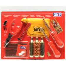 The Gryyp Emergency Puncture Repair Kit is a red and black set featuring a saddle bag with wrenches, tire levers, and CO2 cartridges. The packaging displays illustrations and details of the items.
