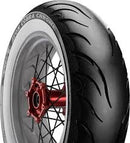 The motorcycle wheel has a red hub, black spokes, and a tire with a white sidewall featuring a zigzag tread pattern. The brand name "Avon Tyres" is visible, specifically from the Avon Cobra Chrome White Walls line.