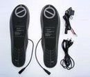 A pair of Keis Heated Soles with attached cables and printed text is displayed. Loose cables and connectors suggest a 12v vehicle supply for powering the insoles, all set against a plain white background.