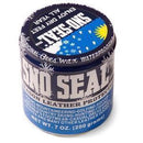 A 7 oz (200g) blue Sno-Seal tin, adorned with snowflakes and a sun, highlights its Beeswax Waterproofing abilities for hiking, skiing, and superior Leather Protection.