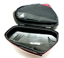 Two black Ventura PANNIER BIKE-PACK KIT bags with red accents and handles are side by side, one slightly in front. These sleek, rectangular motorcycle luggage solutions perfectly fit with Ventura Pannier Frames for an adventurous ride.