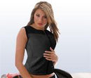 A person with long hair in a sleeveless black top confidently poses against a light background, hand resting on their abdomen. The sleek design of Keis Heated Vests offers stealth warmth while maintaining style.