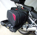Two black Ventura PANNIER BIKE-PACK KIT bags with red accents and handles are side by side, one slightly in front. These sleek, rectangular motorcycle luggage solutions perfectly fit with Ventura Pannier Frames for an adventurous ride.