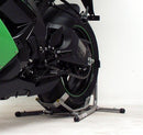 Close-up of a motorcycle's rear, showcasing its green and black design. The bike is displayed on a Ventura Bike Stand, highlighting modern features and detailed mechanics.