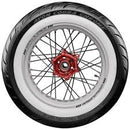 The motorcycle wheel has a red hub, black spokes, and a tire with a white sidewall featuring a zigzag tread pattern. The brand name "Avon Tyres" is visible, specifically from the Avon Cobra Chrome White Walls line.