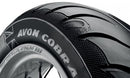Close-up of an Avon Cobra Chrome motorcycle tire from Avon Tyres, highlighting its tread pattern and branding. The Cobra logo is visible on the sidewall against a white background.
