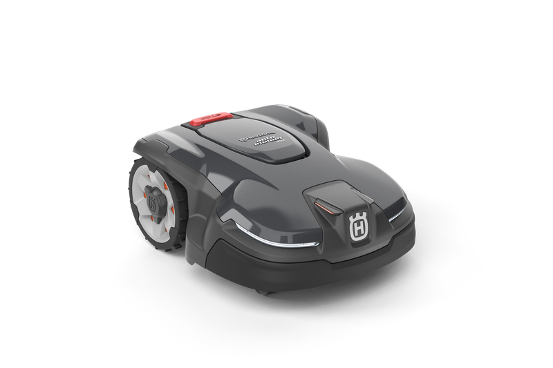 The Husqvarna Automower® 415X robotic lawn mower, in sleek dark gray with white wheels, a red button, and front logo, is displayed on a black background. It includes GPS theft tracking for enhanced security.