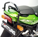 The image showcases a Ventura EVO-12 Bike-Pack Kit, featuring a sleek black EVO-12 pack, an installed EVO-Rack also serving as a Top-Box Rack, and L-brackets with screws. The versatile Adjustable Pack-Rack securely mounts your gear on the Kawasaki KR 150 RR (2003).