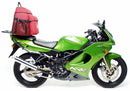 The image showcases a Ventura EVO-12 Bike-Pack Kit, featuring a sleek black EVO-12 pack, an installed EVO-Rack also serving as a Top-Box Rack, and L-brackets with screws. The versatile Adjustable Pack-Rack securely mounts your gear on the Kawasaki KR 150 RR (2003).