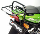 The image showcases a Ventura EVO-12 Bike-Pack Kit, featuring a sleek black EVO-12 pack, an installed EVO-Rack also serving as a Top-Box Rack, and L-brackets with screws. The versatile Adjustable Pack-Rack securely mounts your gear on the Kawasaki KR 150 RR (2003).