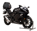The image shows three components of the EVO-12 Bike-Pack Kit: top left is a black EVO-12 pack with red and gray detailing, top right is a Ventura Adjustable Pack-Rack labeled 'Honda', and bottom is a generic L-bracket with screws. Compatible with Kawasaki Z 300 (2015).