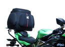The image showcases the Ventura EVO-12 Bike-Pack Kit on a Kawasaki ZX-6R Ninja (19 ->) featuring a sleek black pack with an orange stripe, secured by the versatile Adjustable Pack-Rack and robust black L-Bracket hardware.