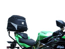 The image showcases the Ventura EVO-12 Bike-Pack Kit on a Kawasaki ZX-6R Ninja (19 ->) featuring a sleek black pack with an orange stripe, secured by the versatile Adjustable Pack-Rack and robust black L-Bracket hardware.