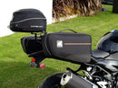 Ventura EVO-12 Bike-Pack Kit for Kawasaki Z 500 and Ninja 500 (all models, '24 onwards) includes a black EVO-12 PACK, metal Adjustable Pack-Rack (EVO-RACK), and metal L-Bracket supports with hardware shown in a generic image.