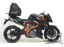 The Ventura EVO-12 Bike-Pack Kit for KTM 990 Super Duke R (05-12) includes a black EVO-12 pack with branding and secure zipper, plus an adjustable metallic pack-rack and L-bracket with screws for stable and easy integration.