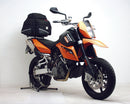 The KTM 990 Super Moto R (09-12) Bike-Pack Kit by Ventura features a sleek black design with vibrant orange accents, an Evo-Rack for seamless fit, and a sturdy L-Bracket including screws. Each component is individually labeled against a spotless white background.