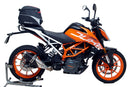 The EVO-12 Bike-Pack Kit image features a sleek black storage bag labeled "EVO-12 Pack," the versatile "Adjustable Pack-Rack" rear rack, and an "L-Bracket" with screws, perfect for mounting on the KTM 390 Duke (17 ->) by Ventura for efficient bike storage.