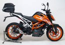 The EVO-12 Bike-Pack Kit image features a sleek black storage bag labeled "EVO-12 Pack," the versatile "Adjustable Pack-Rack" rear rack, and an "L-Bracket" with screws, perfect for mounting on the KTM 390 Duke (17 ->) by Ventura for efficient bike storage.