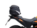 The image showcases a Ventura EVO-12 Bike-Pack Kit for the KTM 390 Adventure (2020 - >), including a black "EVO-12 PACK," an adaptable "Evo-Rack" metal rack, and an "L-BRACKET" with screws, blending practicality and style for any biking adventure.