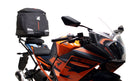 Ventura's EVO-12 Bike-Pack Kit for KTM RC 390 (22 ->) features a sleek black design with an orange stripe, an EVO-RACK for easy mounting, and an L-bracket with screws for seamless installation. It's perfect for riders seeking style and functionality.