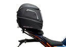 Ventura's EVO-12 Bike-Pack Kit for KTM RC 390 (22 ->) features a sleek black design with an orange stripe, an EVO-RACK for easy mounting, and an L-bracket with screws for seamless installation. It's perfect for riders seeking style and functionality.