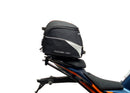 Ventura's EVO-12 Bike-Pack Kit for KTM RC 390 (22 ->) features a sleek black design with an orange stripe, an EVO-RACK for easy mounting, and an L-bracket with screws for seamless installation. It's perfect for riders seeking style and functionality.