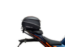 Ventura's EVO-12 Bike-Pack Kit for KTM RC 390 (22 ->) features a sleek black design with an orange stripe, an EVO-RACK for easy mounting, and an L-bracket with screws for seamless installation. It's perfect for riders seeking style and functionality.
