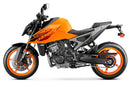 Image showing a Ventura EVO-12 Bike-Pack Kit for KTM 990 Duke (24 - >) with three components: EVO-12 pack bag, Evo-Rack mounted on the motorcycle, and L-brackets with screws. Generic image shown.