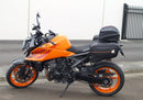 Image showing a Ventura EVO-12 Bike-Pack Kit for KTM 990 Duke (24 - >) with three components: EVO-12 pack bag, Evo-Rack mounted on the motorcycle, and L-brackets with screws. Generic image shown.