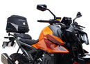 Image showing a Ventura EVO-12 Bike-Pack Kit for KTM 990 Duke (24 - >) with three components: EVO-12 pack bag, Evo-Rack mounted on the motorcycle, and L-brackets with screws. Generic image shown.