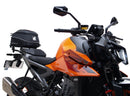 Image showing a Ventura EVO-12 Bike-Pack Kit for KTM 990 Duke (24 - >) with three components: EVO-12 pack bag, Evo-Rack mounted on the motorcycle, and L-brackets with screws. Generic image shown.